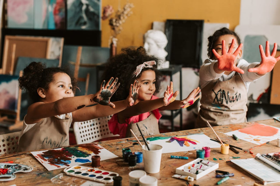 kids in a playroom colouring